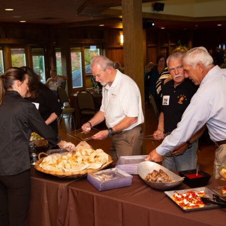 a group of people serving food