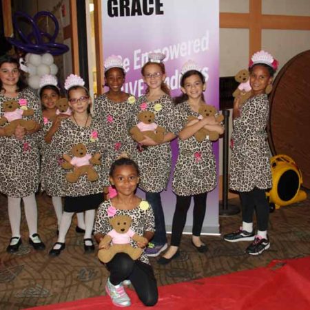 a group of young children posing for a photo