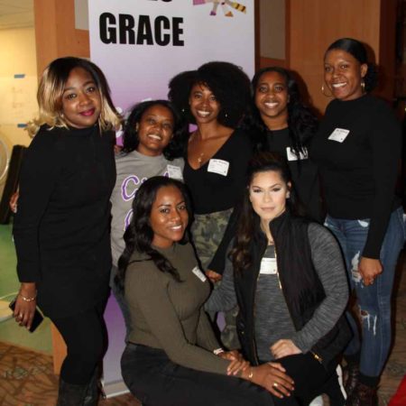 a group of women posing for a photo