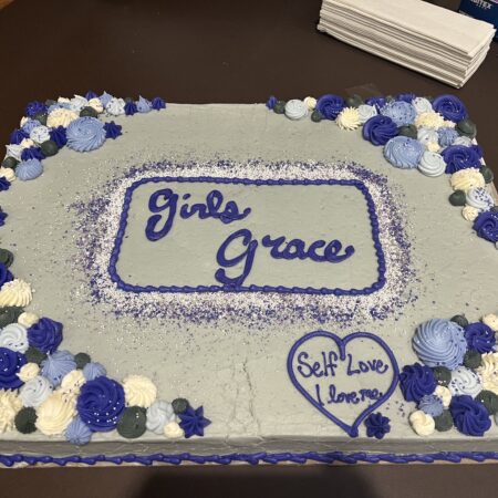 a cake with blue and white frosting