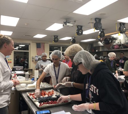 a group of people in a kitchen