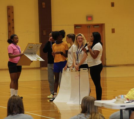 a group of people in a gym