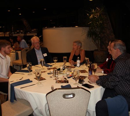 a group of people sitting at a table