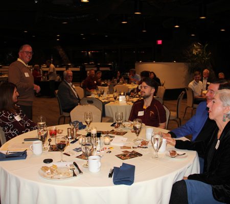 a group of people sitting at a table