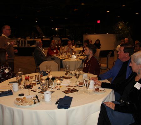 a group of people sitting at a table