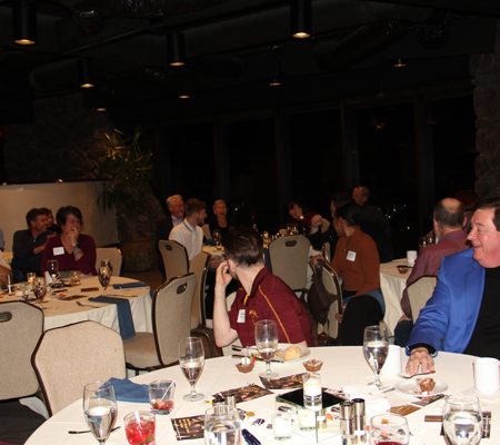 a group of people sitting at tables