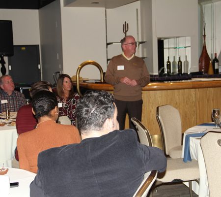 a person standing in front of a group of people