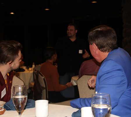 a group of people sitting at a table