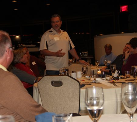 a person giving a presentation to a group of people