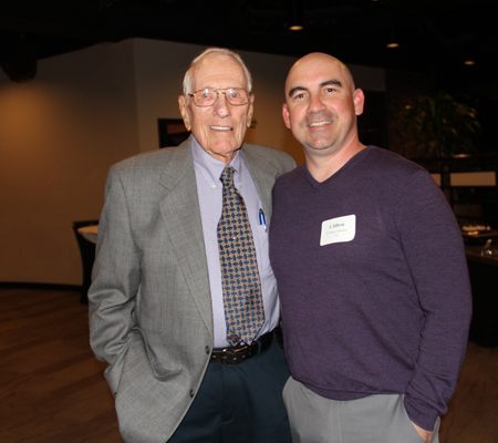 a couple of men posing for a photo