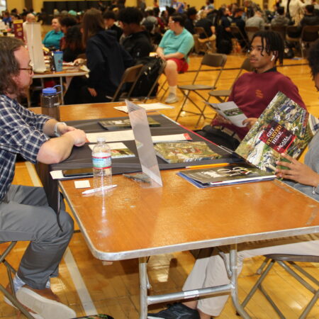 a group of people sitting at tables