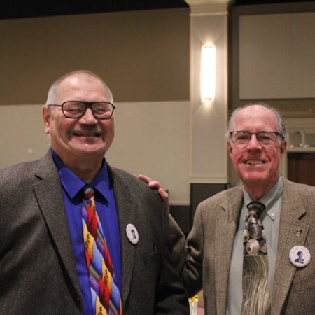 a couple of men wearing ties