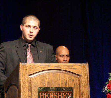a person standing at a podium