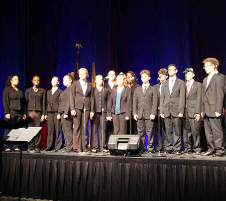 a group of people performing on a stage