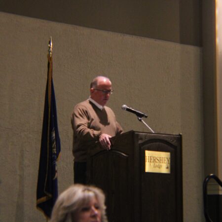 a person standing at a podium