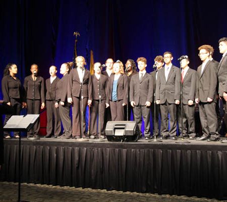 a group of people standing on a stage