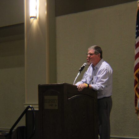a person speaking into a microphone