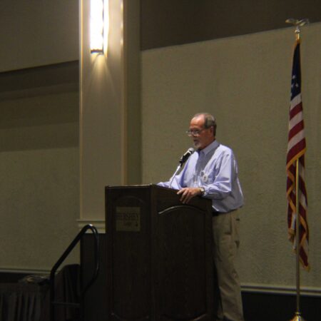 a person standing at a podium