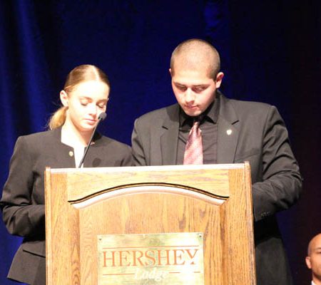 people standing at a podium