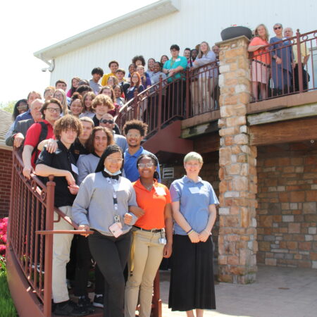 a group of people standing on a staircase