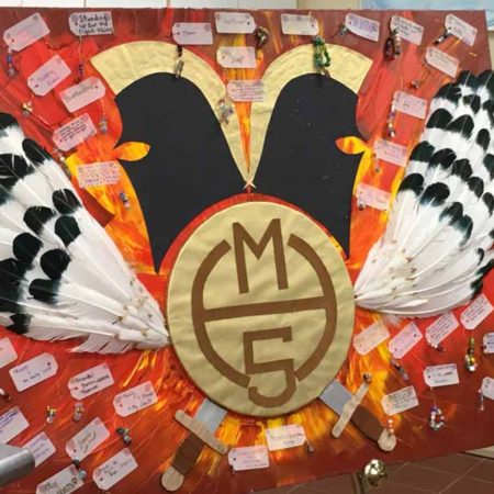 a board with feathers and a logo