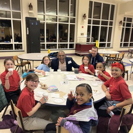 a group of people sitting around a table