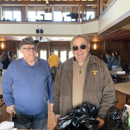 two men standing in a room