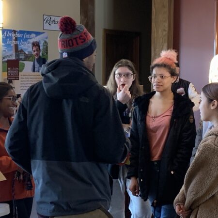 a group of people standing in a room