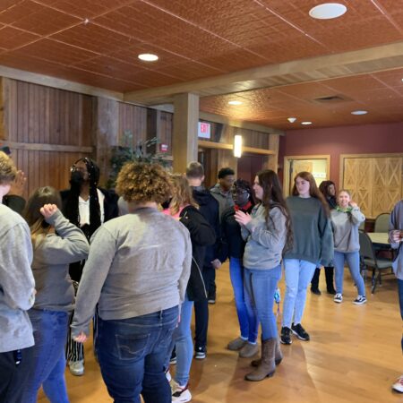a group of people standing in a room