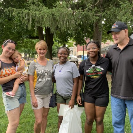 a group of people standing in a park