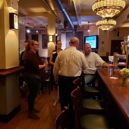 a group of people in a bar