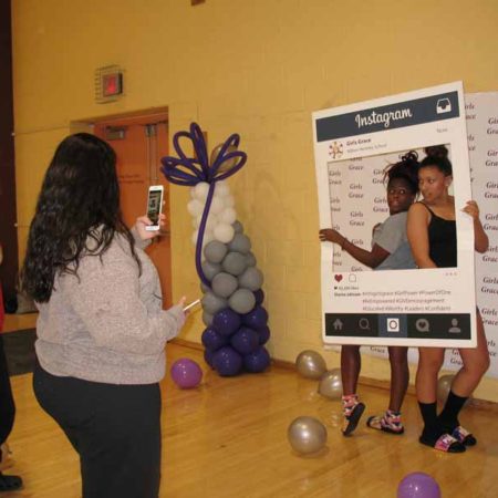 a person taking a picture of a poster