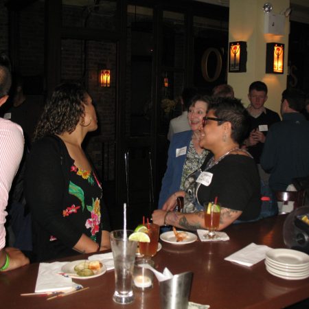a group of people at a bar