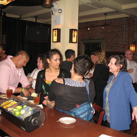 a group of people at a bar