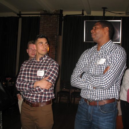 a group of men standing in a room