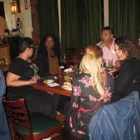 a group of people sitting around a table