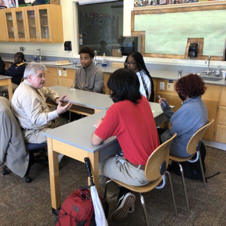 a group of people sitting at tables