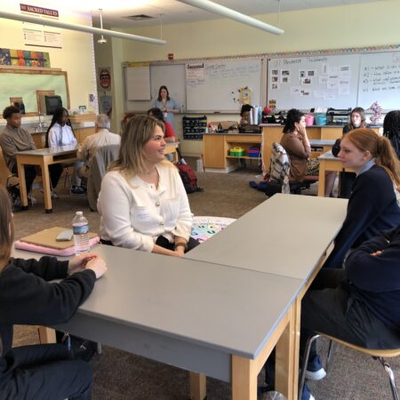 a group of people sitting at a table