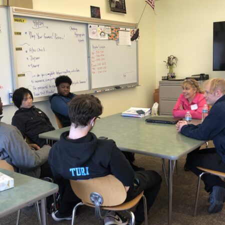 a group of people sitting at a table