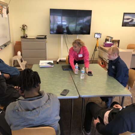 a group of people sitting around a table
