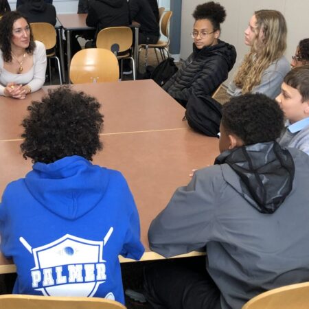 a group of people sitting at a table