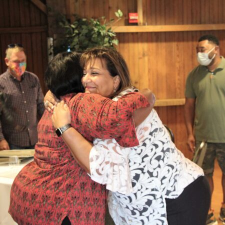 a group of women hugging