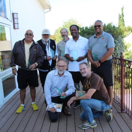 a group of men posing for a photo