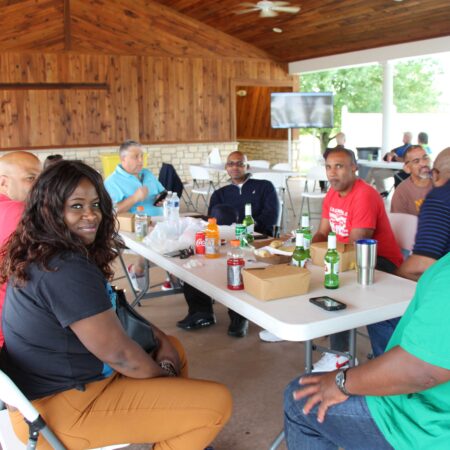 a group of people sitting around a table