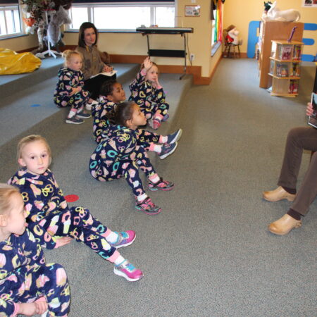 a group of children sitting on the floor