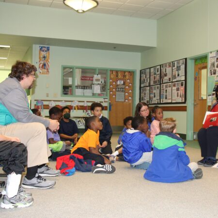 a group of children sitting on the floor