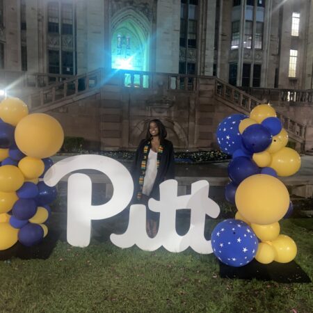 a person standing in front of a sign