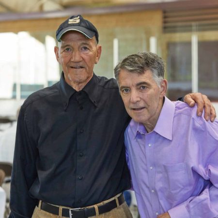 a couple of men posing for a photo