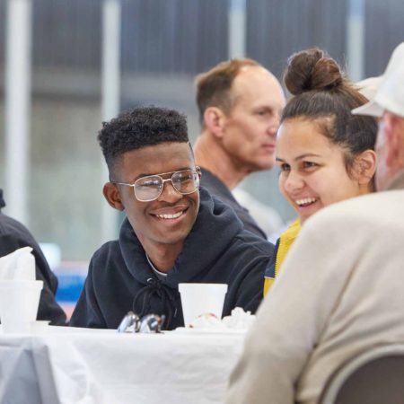 a group of people sitting at a table
