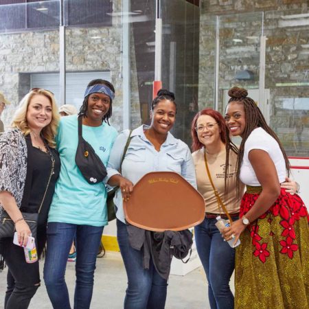 a group of women posing for a photo